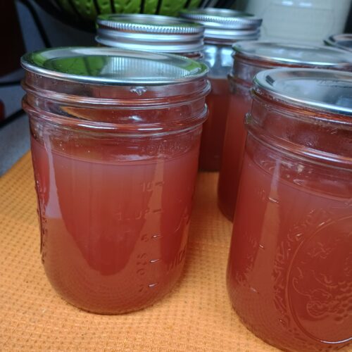 homemade canned red grape jelly in mason jars